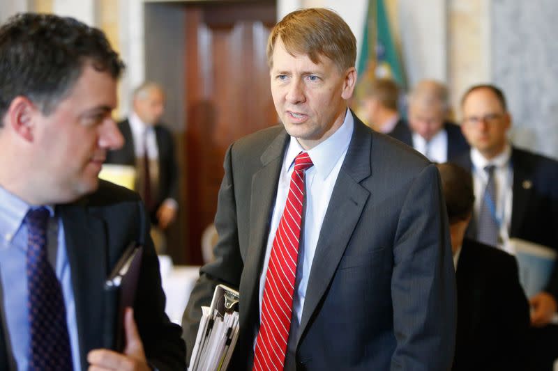 Cordray departs following a meeting of the Financial Stability Oversight Council at the Treasury Department in Washington