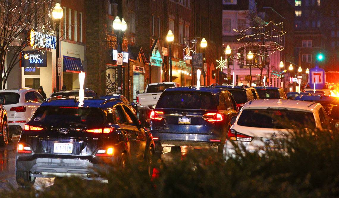 The Menorah Car Parade travels through downtown State College on Sunday before the lighting of a 6 foot tall public Jewish Hanukkah menorah at Old Main.