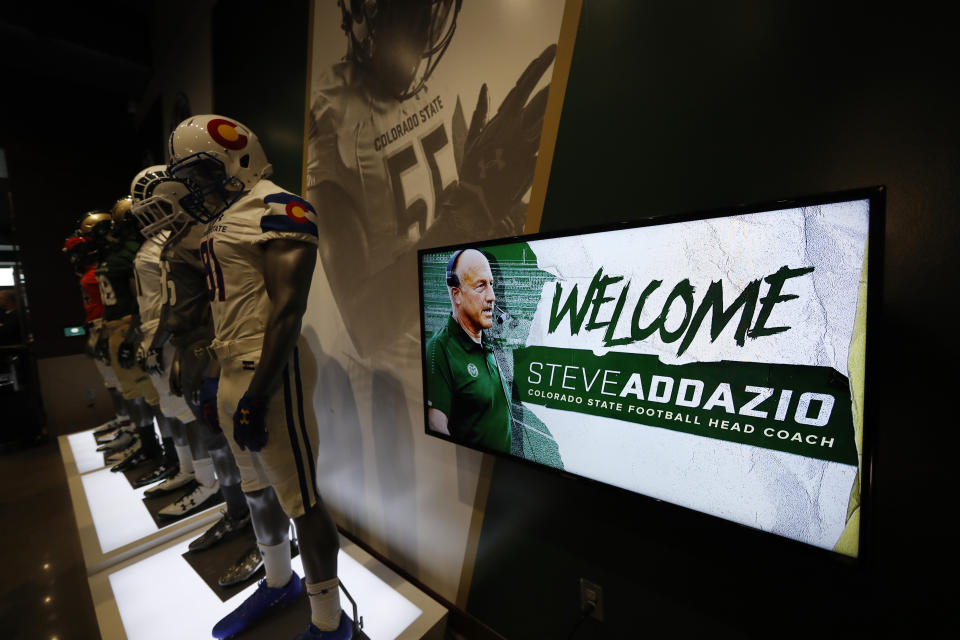 A welcome sign flashes during an announcement that Steve Addazio has been hired as the new head football coach at Colorado State University at a news conference at the school Thursday, Dec. 12, 2019, in Fort Collins, Colo. (AP Photo/David Zalubowski)