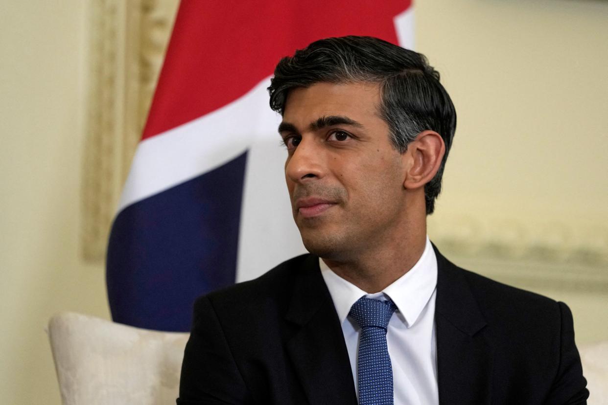 Britain's Prime Minister Rishi Sunak listens as South Korea's President Yoon Suk Yeol speaks to the media during their meeting, inside 10 Downing Street in central London on November 22, 2023, on the second of the President's three-day state visit to the UK. (Photo by Kin Cheung / AFP) (Photo by KIN CHEUNG/AFP via Getty Images)