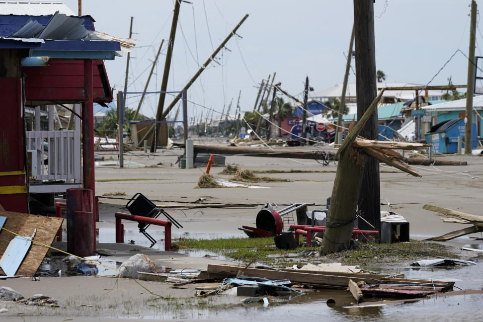 The remains of destroyed homes and businesses are seen in the aftermath of Hurricane Ida in Grand Isle, La., Tuesday, Aug. 31, 2021. (AP Photo/Gerald Herbert)