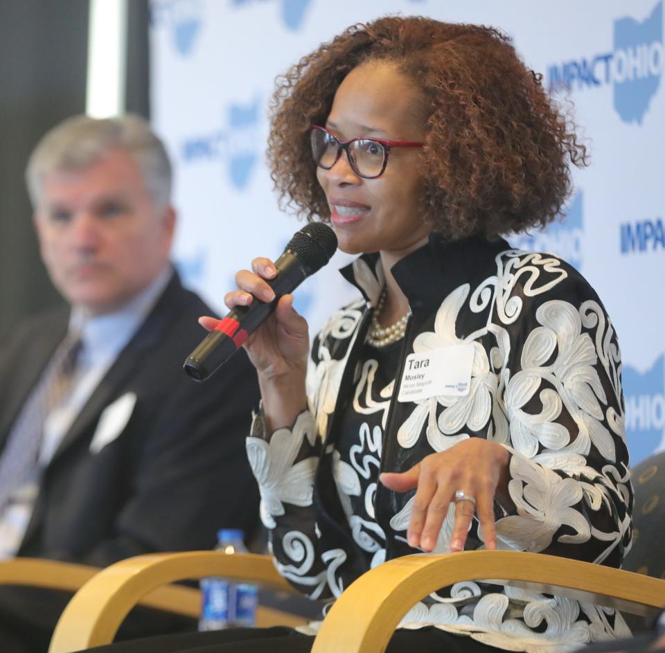 Tara Mosley answers a question during an Akron mayoral candidate forum hosted by Impact Ohio and the Greater Akron Chamber on Friday at the University of Akron's InfoCision Stadium.
