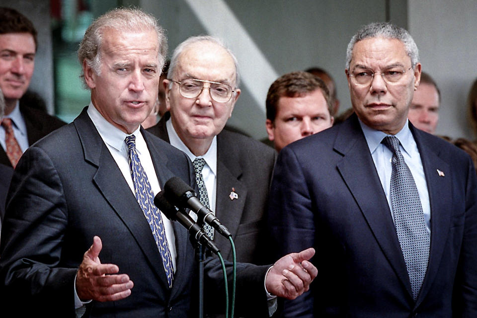 SenJoe Biden, D-Del., addresses reporters as Sen. Jesse Helms, R-N.C., center, and Secretary of State Colin Powell look on after meetings Oct. 3, 2001, at the State Department in Washington, DC. (Manny Ceneta / AFP - Getty Images file)