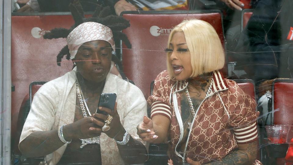 Rapper Kodak Black and fianc&#xe9; Mellow Rackz watch the Florida Panthers play the Vancouver Canucks at the FLA Live Arena on January 11, 2022 in Sunrise, Florida. (Photo by Joel Auerbach/Getty Images)
