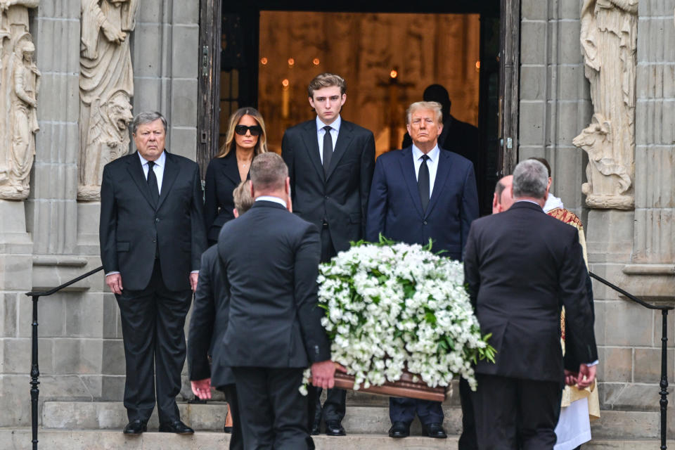 Former US President Donald Trump (center right) stands with his wife Melania Trump (2L) their son Barron Trump (center left) and father-in-law Viktor Knavs, as the coffin carrying the remains of Amalija Knavs, the former first lady's mother, is carried into the Church of Bethesda-by-the-Sea for her funeral, in Palm Beach, Florida, on January 18, 2024. Former first lady Melania Trump's mother Amalija Knavs, 78, died January 9, 2024 in Miami following an undisclosed illness. (Photo by GIORGIO VIERA / AFP) (Photo by GIORGIO VIERA/AFP via Getty Images)
