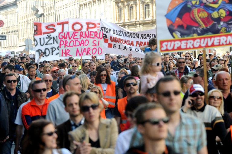 Holders of Swiss franc mortgages and their supporters take part in a march in Zagreb to protest the government's and central bank's failure to find a lasting solution for the issue, April 25, 2015