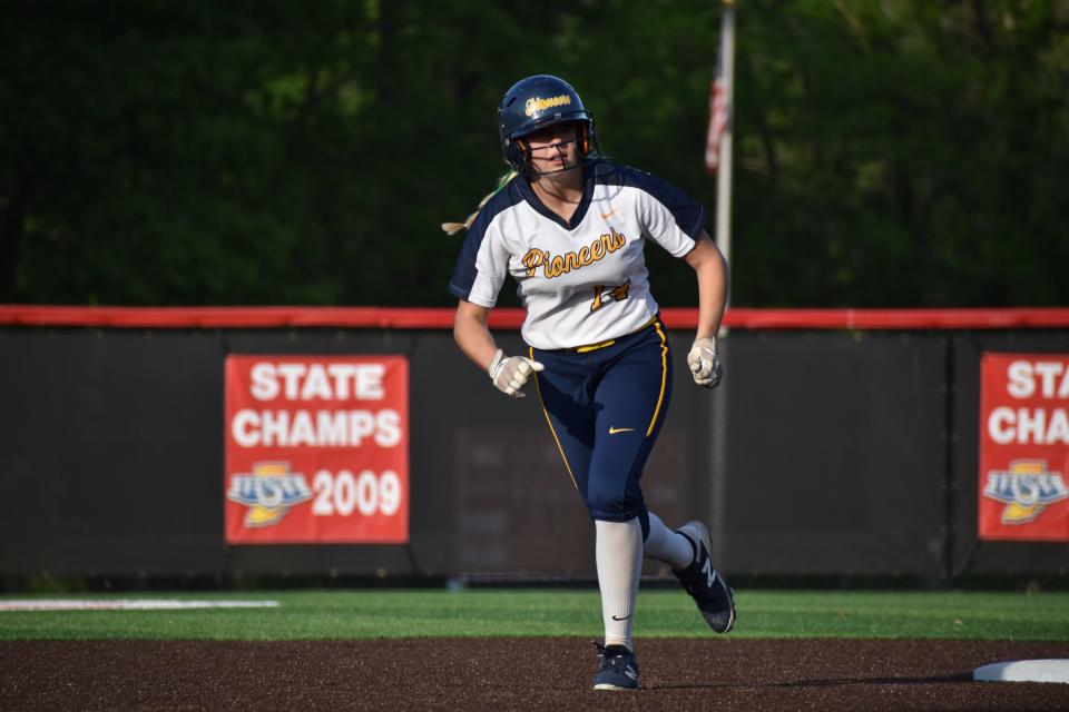 Mooresville's Kendall Grover makes a dash to third base during the Pioneers' game with Center Grove on May 12, 2022.