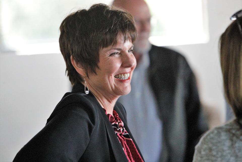 Redding City Council member Julie Winter talks to guests at the launch party for council candidate Alex Shea on Saturday, March 12, 2022.