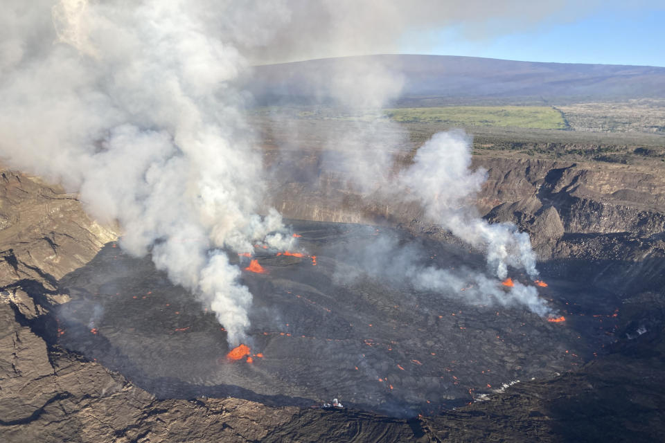 In this aerial photo provided by the U.S. Geological Survey, an eruption takes place on the summit of the Kilauea volcano in Hawaii, Wednesday, June 7, 2023. Hawaii tourism officials urged tourists to be respectful when flocking to a national park on the Big Island to get a glimpse of the latest eruption of Kilauea, one of the world's most active volcanoes. (U.S. Geological Survey via AP)