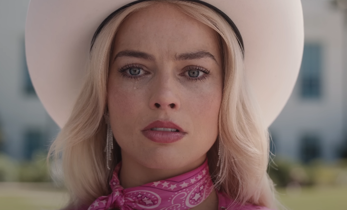 Closeup of Margot Robbie as Barbie tearing up