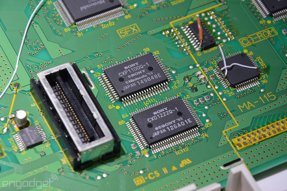 A close-up of the "Nintendo PlayStation" circuit board shows both companies' branding on the chips.