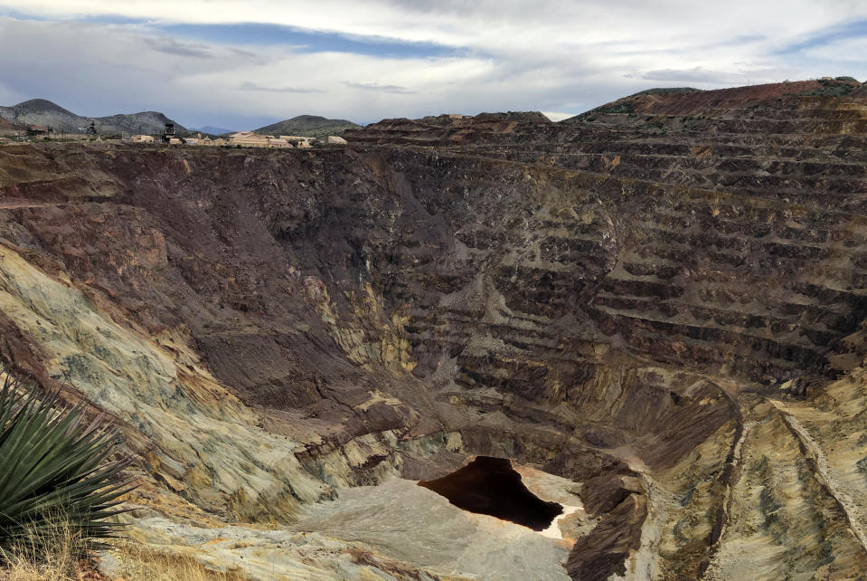 FILE - The Lavender pit mine, where a copper operation stopped in 1974, sits outside Bisbee, Ariz., on May 12, 2019. National conservation groups, tribes and others in Nevada are up in arms over a pro-mining bill Sen. Catherine Cortez Masto, D-Nev., introduced this week. It would insulate mining companies from a U.S. appeals court ruling that blocked a copper mine in Arizona and is now part of a legal battle over a big lithium mine near the Nevada-Oregon line. Allies on most other conservation issues, environmentalists are accusing Cortez Masto of becoming a puppet for the mining industry. (AP Photo/Anita Snow, File)