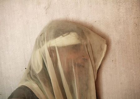 A village woman mourns the death of her relative whom locals say was killed by firing from the Pakistan side of the border at Arnia village, near Jammu October 6, 2014. REUTERS/Mukesh Gupta