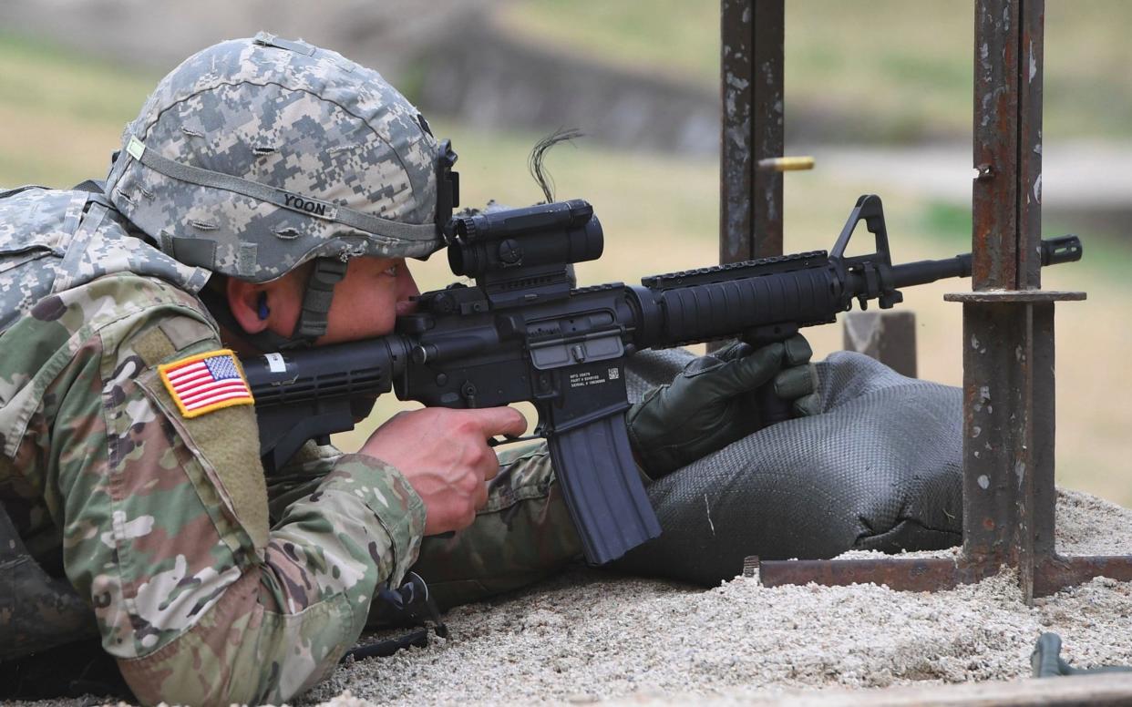 A US soldier aims his rifle at a shooting range at Camp Casey in Dongducheon, north of Seoul - AFP