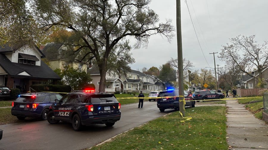 Grand Rapids police on Horton Avenue SE near Melville Street on Nov. 6, 2023, as they investigate the deaths of two people.