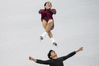 Figure skating athletes Sui Wenjing and Han Cong of China train at Capital Indoor Stadium at the 2022 Winter Olympics, Wednesday, Feb. 2, 2022, in Beijing. (AP Photo/Bernat Armangue)