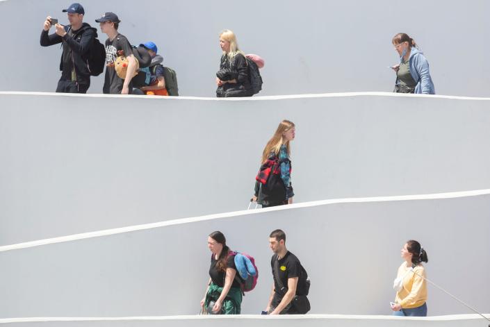 Ukrainians head to the U.S. on the Chaparral Pedestrian Port of Entry to be processed for asylum in Tijuana, Mexico on April 6, 2022. 