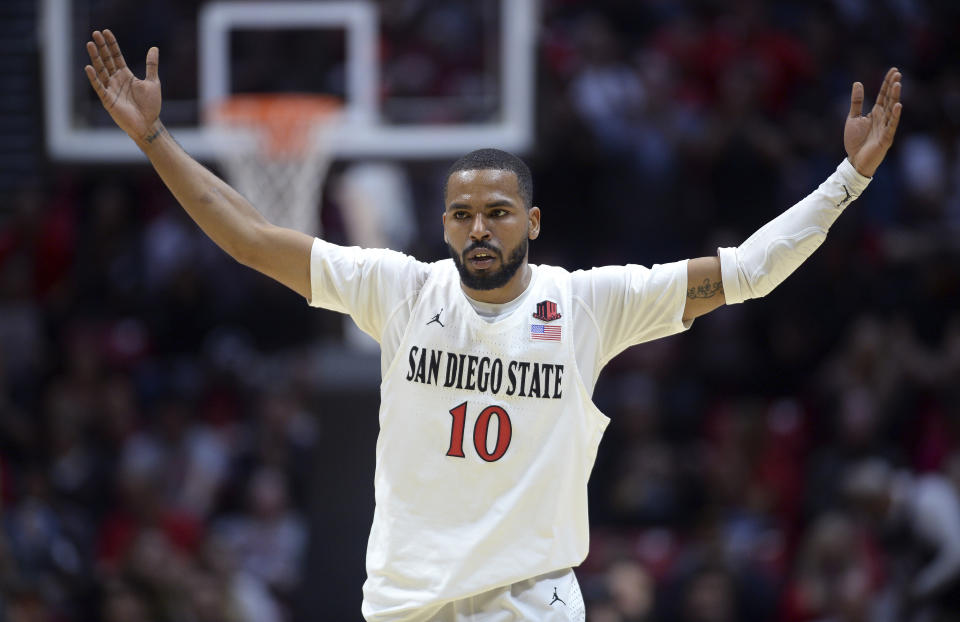 San Diego State guard KJ Feagin gestures during the first half of an NCAA college basketball game against Fresno State Wednesday, Jan. 1, 2020, in San Diego. (AP Photo/Orlando Ramirez)