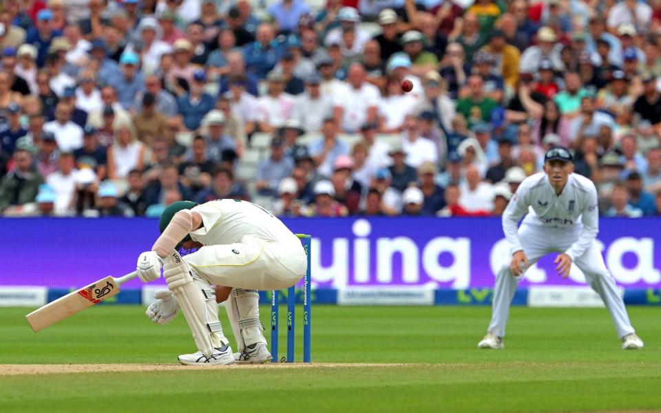 Scott Boland ducks under a bouncer from Stuart Broad