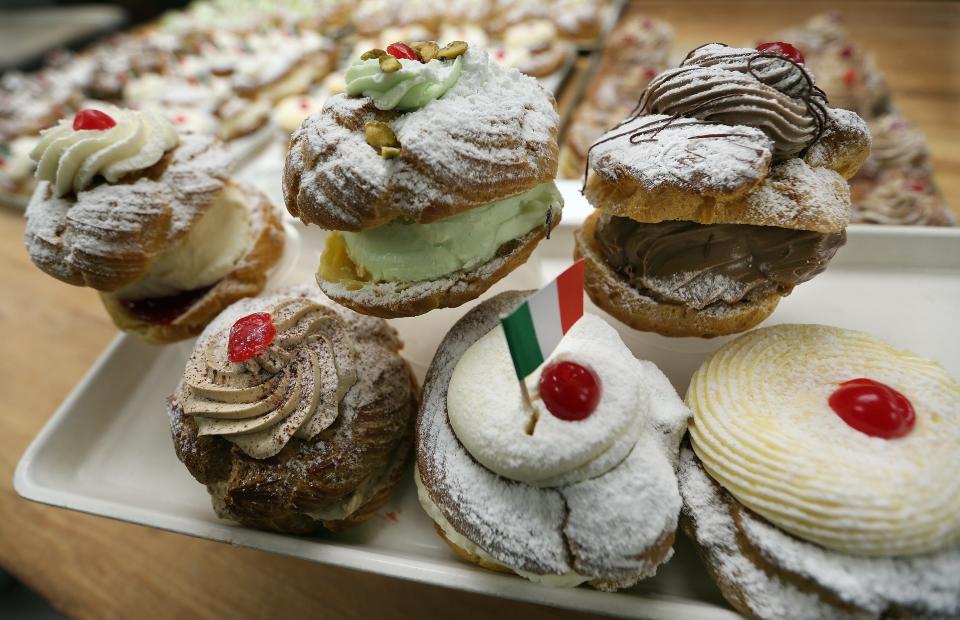 Zeppole made at the Original Italian bakery in Johnston include whipped cream and raspberry, pistachio, chocolate, Irish cream, ricotta and traditional pastry cream.