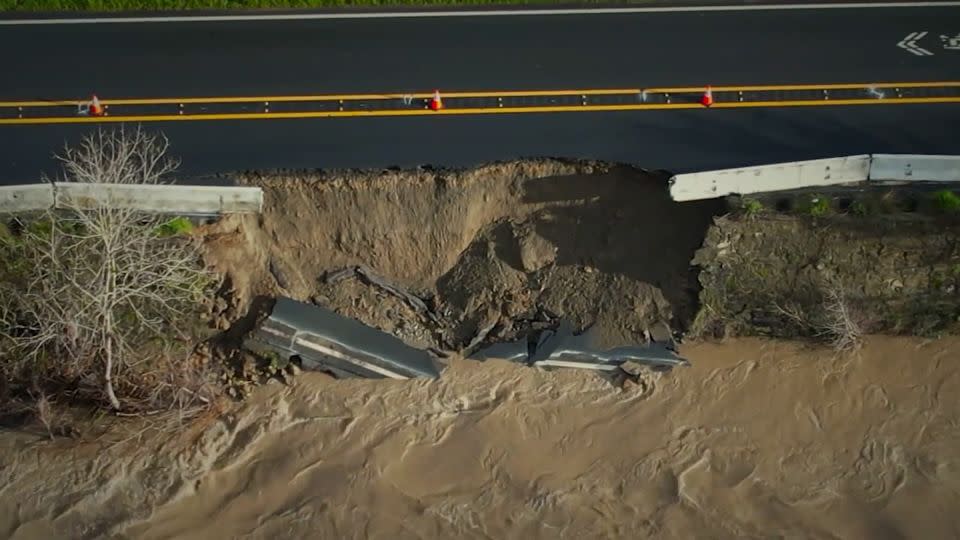 An aerial view from affiliate KGO shows a portion of California state route 84 cracked and slipping into Alameda Creek on Monday morning. - KGO