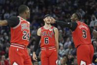 Chicago Bulls guard Alex Caruso (6) celebrates next to center Andre Drummond (3) after making a 3-point basket during the first half of an NBA basketball game against the Minnesota Timberwolves, Sunday, March 31, 2024, in Minneapolis. (AP Photo/Abbie Parr)