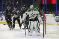 Dallas Stars goaltender Anton Khudobin stands in front of the goal as Tampa Bay Lightning players celebrate a goal during the second period of an NHL hockey game Saturday, Feb. 27, 2021, in Tampa, Fla. (AP Photo/Mike Carlson)