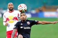 Nov 8, 2014; Washington, DC, USA; D.C. United defender Sean Franklin (5) chases the ball in front of New York Red Bulls forward Thierry Henry (14) in the first half of leg 2 of the Eastern Conference semifinals in the 2014 MLS Cup Playoffs at Robert F. Kennedy Memorial Stadium. Mandatory Credit: Geoff Burke-USA TODAY Sports