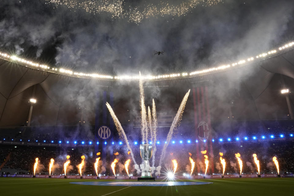 Fireworks explode before the Italian Super Cup final soccer match between AC Milan and Inter Milan at the King Saud University Stadium, in Riyadh, Saudi Arabia, Wednesday, Jan. 18, 2023. (AP Photo/Hussein Malla)