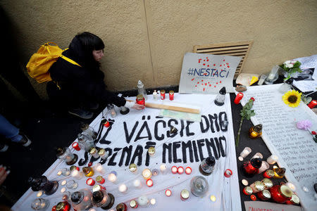 People light candles during a march in reaction to the murder of Slovak investigative reporter Jan Kuciak and his fiancee Martina Kusnirova, in Bratislava, Slovakia March 23, 2018. REUTERS/David W. Cerny