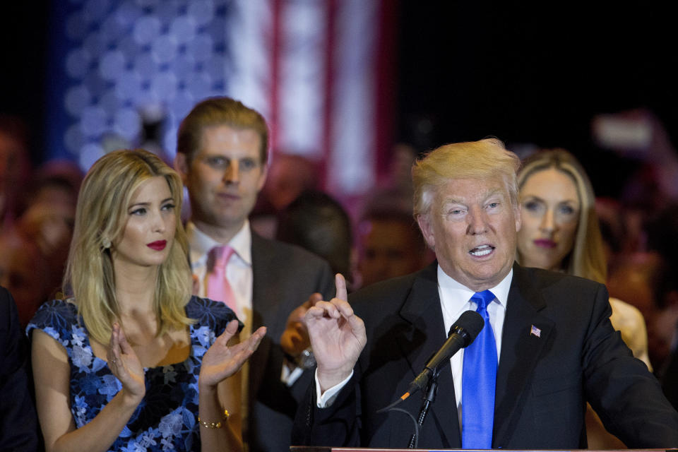 FILE - In this Tuesday, May 3, 2016 file photo, Republican presidential candidate Donald daughter Ivanka, left, and son Eric, background left, as he speaks during a primary night news conference in New York. The barbs that have flown between President Donald Trump and his family and Chicago Mayor Lori Lightfoot haven’t prevented either side from engaging occasionally in niceties. (AP Photo/Mary Altaffer, File)