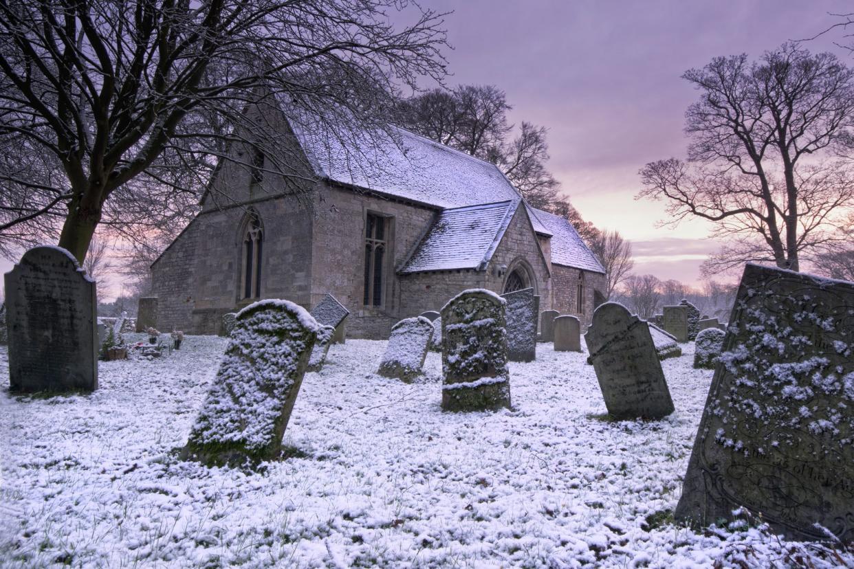 Winter sunrise over cemetery 