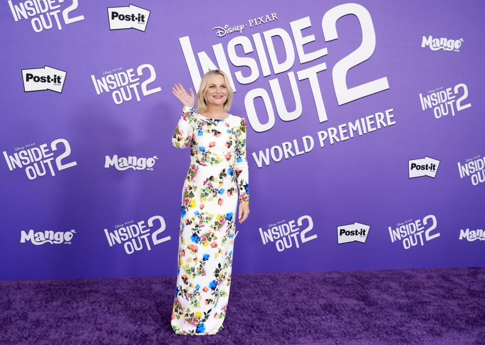 Amy Poehler, a cast member in "Inside Out 2," waves to photographers at the premiere of the film at the El Capitan Theatre, Monday, June 10, 2024, in Los Angeles. (AP Photo/Chris Pizzello)