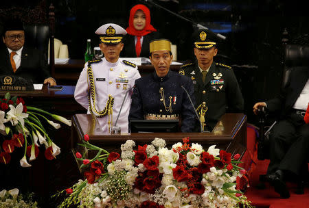 FILE PHOTO: Indonesia president Joko Widodo (C) speaks in front of parliament members ahead of Thursday's independence day in Jakarta, Indonesia, August 16, 2017. REUTERS/Beawiharta/File Photo
