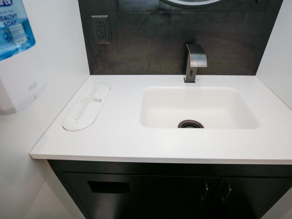 A sink with hand sanitizer.