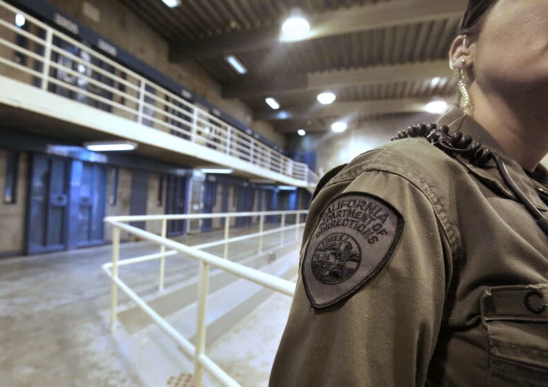 FILE - This Aug. 17, 2011 file photo shows a correctional officer in one of the housing units at Pelican Bay State Prison near Crescent City, Calif. Scott Kernan, the newly appointed Secretary of the California Department of Corrections and Rehabilitation, said that he plans to boost training for prison employees as he tries to change a culture that often pits prison guards against inmates and outsiders, during an interview with The Associated Press, Monday, Feb. 8, 2016. Kernan took over as secretary last month after starting as a correctional officer himself in 1983. (AP Photo/Rich Pedroncelli, file)