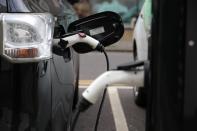 Electric cars charge on a street in London