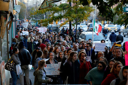 People take part in a protest against Republican president-elect Donald Trump at the Washington Square park in the neighborhood of Manhattan in New York, U.S., November 11, 2016. REUTERS/Eduardo Munoz