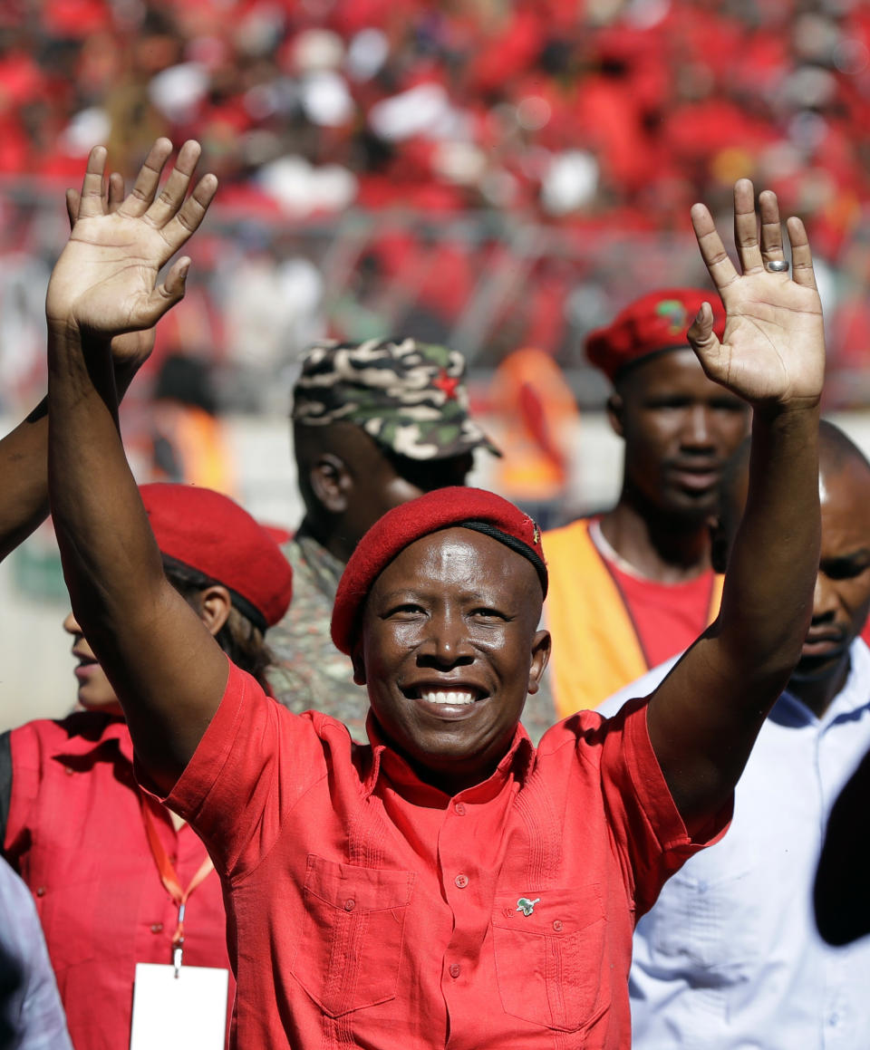 Leader of the Economic Freedom Fighters (EFF) party, Julius Malema, greets supporters as he arrives at Orlando Stadium in Soweto, South Africa, Sunday, May 5, 2019. Campaign rallies for South Africa’s upcoming election have reached a climax Sunday with mass rallies by the ruling party and one of its most potent challengers. (AP Photo/Themba Hadebe)