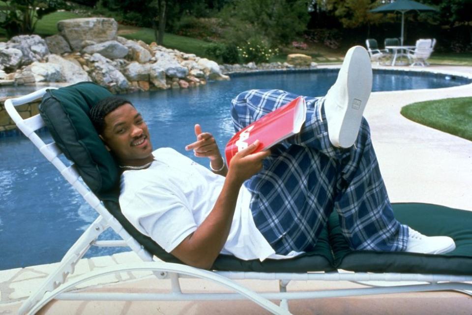 <p>Will Smith wears plaid pants to the pool in 1996.</p>