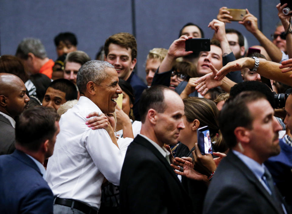 Former President Barack Obama greets supporters as he campaigns in support of California congressional candidates, Saturday, Sept. 8, 2018, in Anaheim, Calif. (AP Photo/Ringo H.W. Chiu)