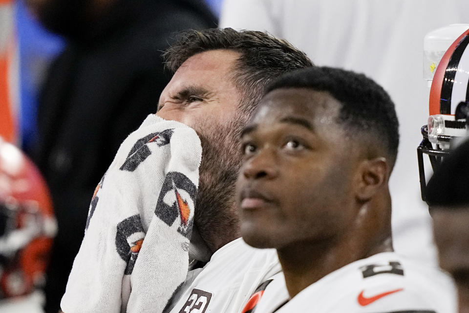 Cleveland Browns quarterback Joe Flacco wipes his face on the bench during the second half of an NFL wild-card playoff football game against the Houston Texans Saturday, Jan. 13, 2024, in Houston. (AP Photo/David J. Phillip)
