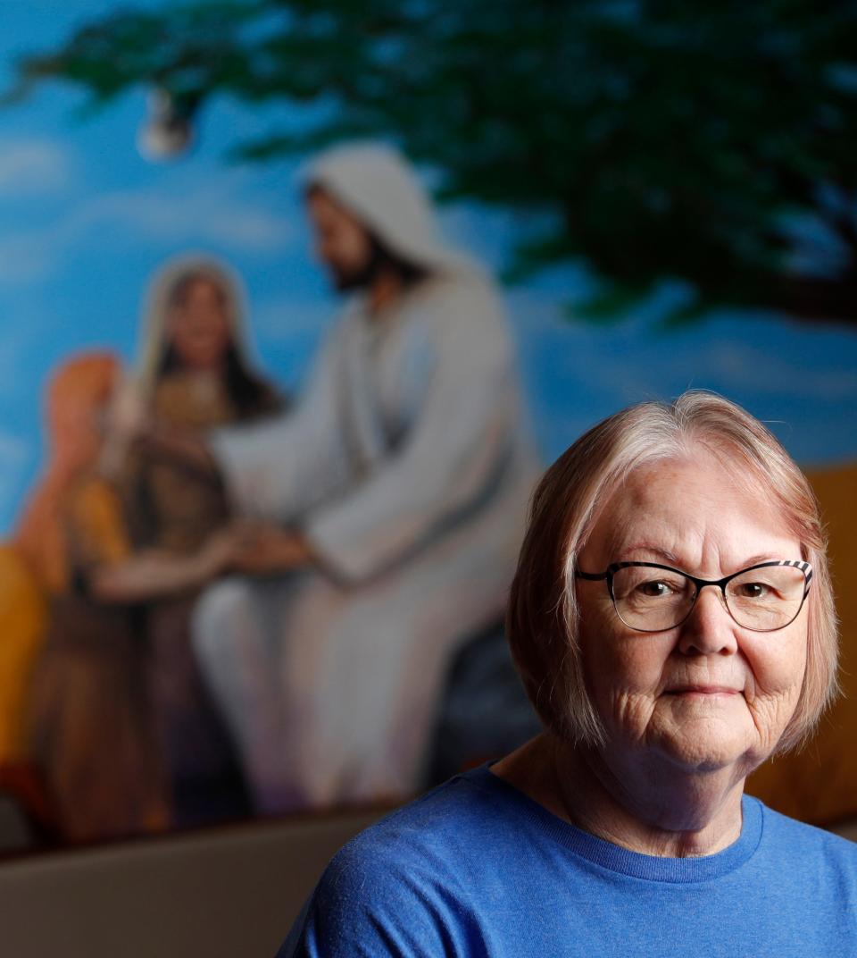 The Rev. Jane Williams, an Assemblies of God minister, sits in the sanctuary of Revive Church in Edmond, where she is a member.