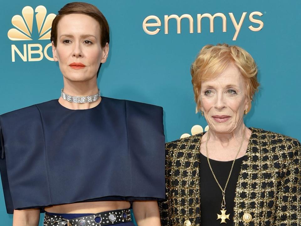 sara paulson and holland taylor posing for photos on the red carpet of the 2022 emmy awards