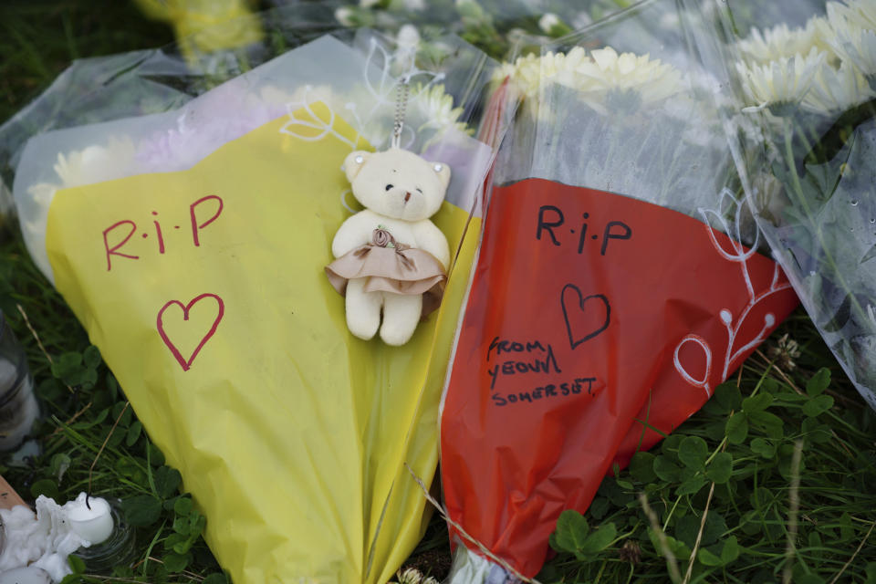 Flowers are left at the scene of a shooting in the Keyham area of Plymouth, England, Saturday, Aug. 14, 2021. Britain’s police watchdog says it has launched an investigation into why a 22-year-old man who fatally shot five people in southwestern England was given back his confiscated gun and gun license. Police have said Jake Davison killed his mother and four other people, including a 3-year-old girl, before taking his own life in Plymouth. (Ben Birchall/PA via AP)