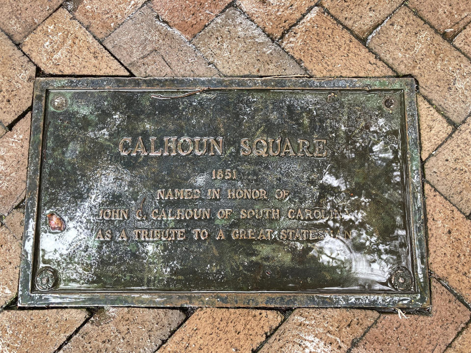A plaque marking the 1851 dedication of Calhoun Square in Savannah, Ga., is shown recessed into a walkway on Nov. 10, 2022. Savannah's city council had the marker and signs removed from the square when it voted to strip the honor to former U.S. Vice President John C. Calhoun, who had been a vocal advocate for slavery. As the city council prepares to choose a new name, a list of recommended finalists includes the names of four Black people, a Native American tribe and a group of women. (AP Photo/Russ Bynum)