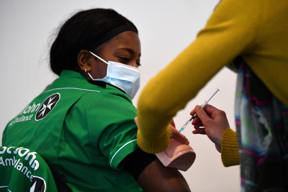 Volunteers learn how to administer an injection during a vaccinator training day lesson ran by the St John’s Ambulance in Canary Wharf, east London, on 30 January, 2021. (AFP via Getty Images)