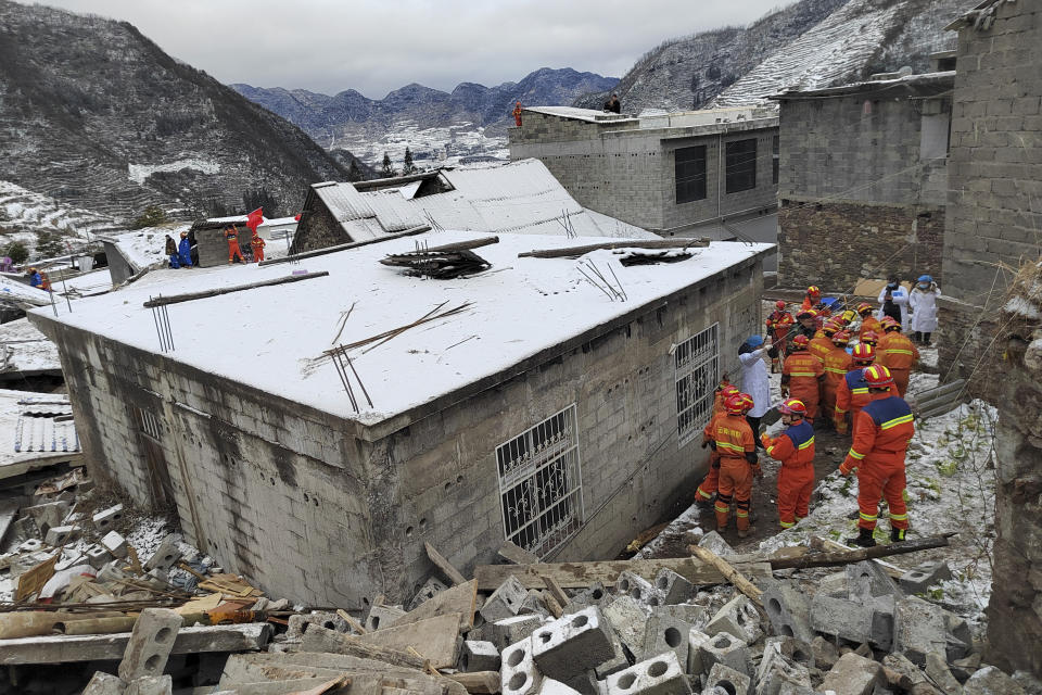 In this photo released by Xinhua News Agency, rescue workers search the site of a landslide in Liangshui village, Tangfang Town in the city of Zhaotong, southwestern China's Yunnan Province, Monday, Jan. 22, 2024. The landslide in southwestern China's mountainous Yunnan province early Monday buried dozens and forced the evacuation of hundreds. (Xinhua via AP)