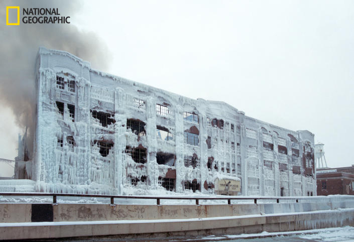 A warehouse caught fire in the Bridgeport neighborhood in Chicago last month. As the firemen doused it in water, it froze against the building, encasing it in thick ice. (Photo and caption Courtesy Reuben Wu / National Geographic Your Shot) <br> <br> <a href="http://ngm.nationalgeographic.com/your-shot/weekly-wrapper" rel="nofollow noopener" target="_blank" data-ylk="slk:Click here" class="link ">Click here</a> for more photos from National Geographic Your Shot.