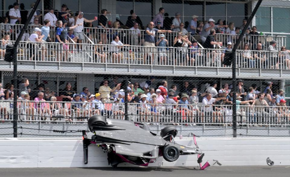 Andretti Autosport driver Kyle Kirkwood (27) slides through the SAFER barrier on turn two after crashing with Arrow McLaren SP driver Felix Rosenqvist (6) on Sunday May 28, 2023, in the 107th race of the Indianapolis 500 at Indianapolis Motor Speedway.